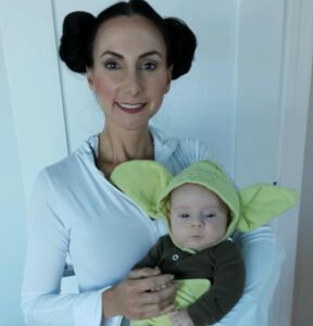 CEO Michelle Constant and son wearing Star Wars costumes.