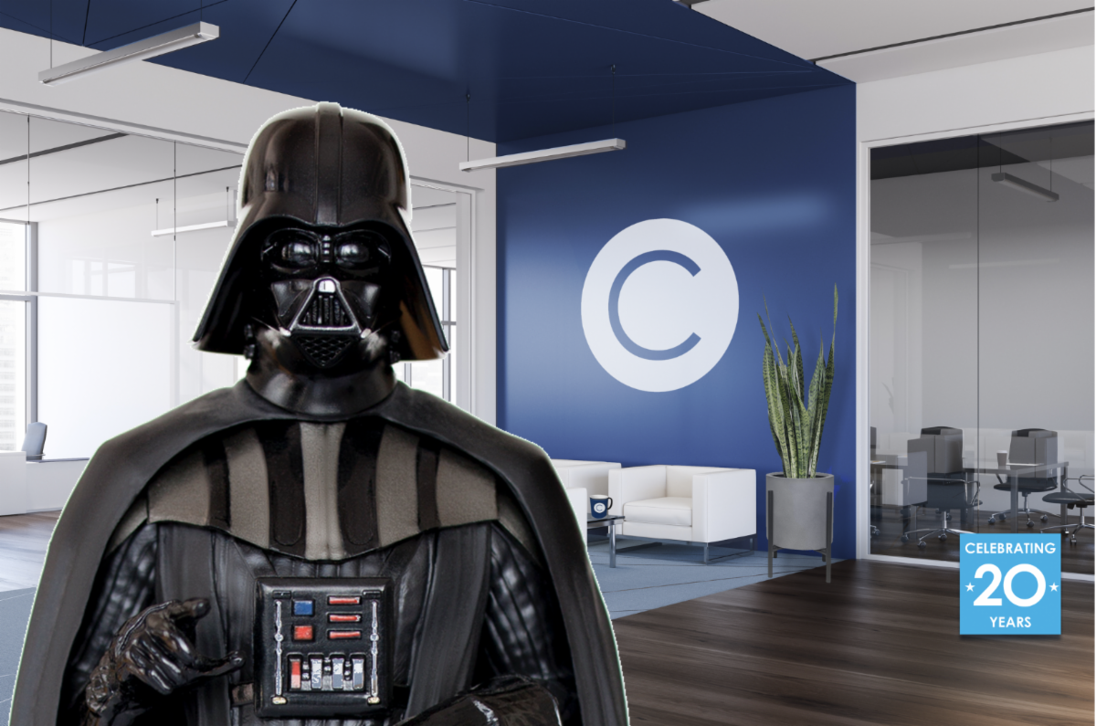 Office lobby featuring a logo on the wall with a circle and a "C". In front, Darth Vader.