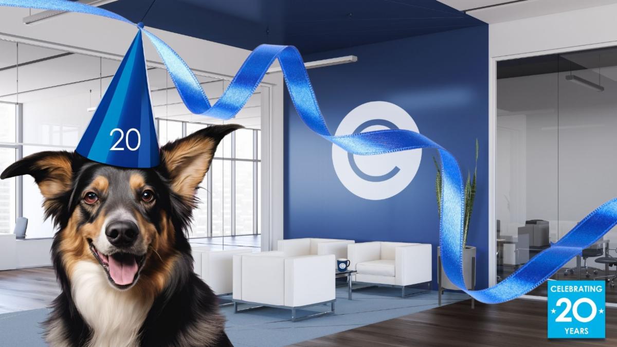 CONSTANT's virtual office background features a navy blue wall with a white circle and a cut out for "C." Light blue rug has four white chairs on it, with two in each row facing toward each other. Office background is overlayed by a brown and black dog on the left side wearing a blue party hat saying 20.